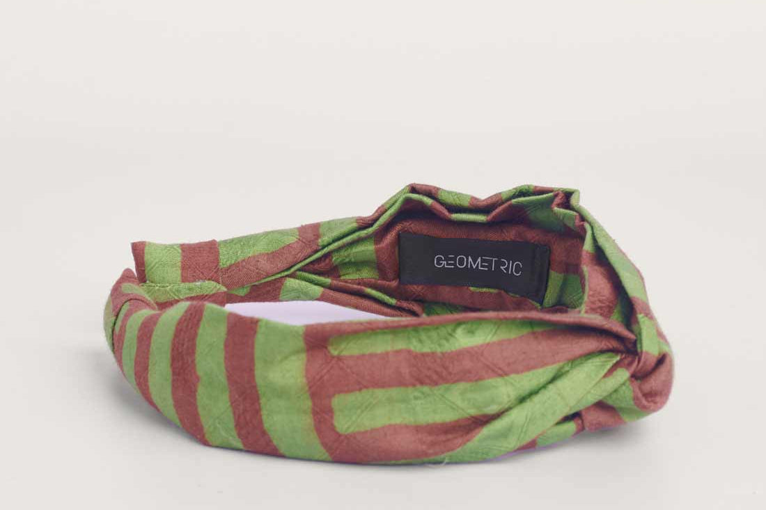 Green and brown hand-dyed batik Garden Party print headband by GEOMETRIC.