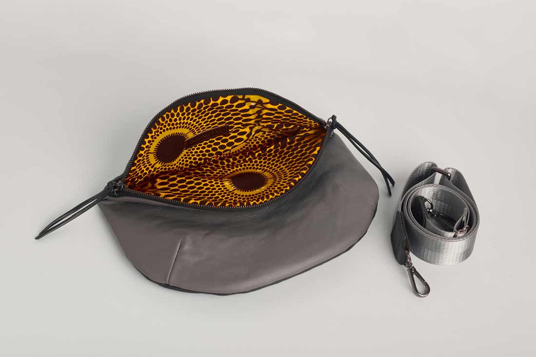Inside view of charcoal leather Crescent cross-body bag by Geometric.