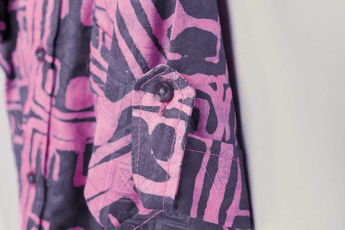 Close-up of hand-dyed blue Coco batik print short sleeve button up shirt by GEOMETRIC.