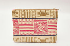 Tan and pink hand-dyed Kente print Zipper Clutch by GEOMETRIC.