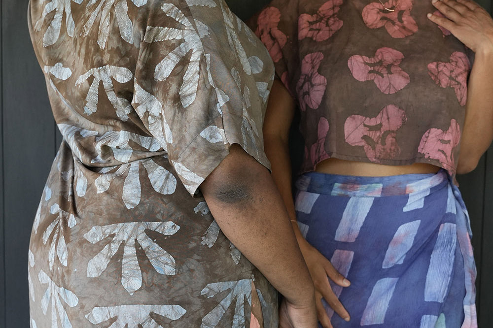 Two women standing together with woman on the left wearing batik print Wedgewood Kimono by Geometric.