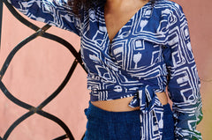 Woman wearing blue hand-dyed batik Coco print long sleeve wrap top by GEOMETRIC.