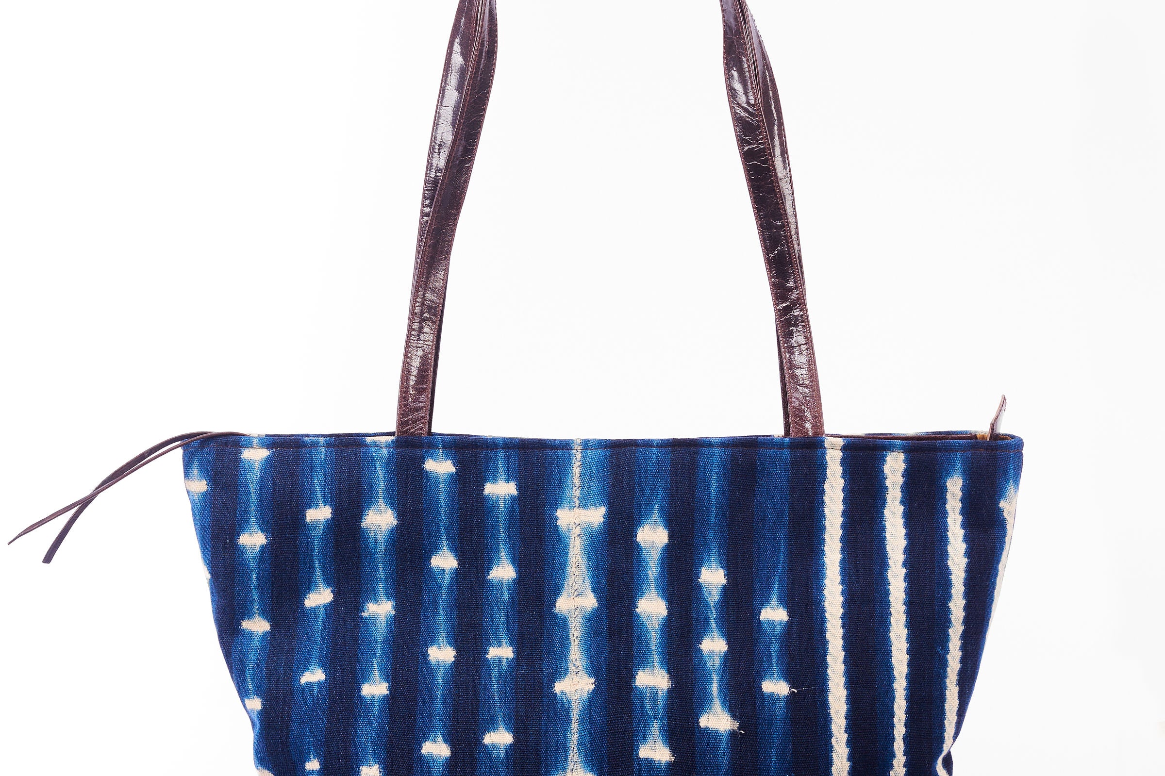 Hand-dyed indigo fabric and leather Tema tote bag by GEOMETRIC.