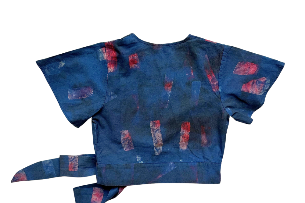 Back view of hand-dyed blue Brushstrokes batik print Short Sleeve Wrap Top by GEOMETRIC. 