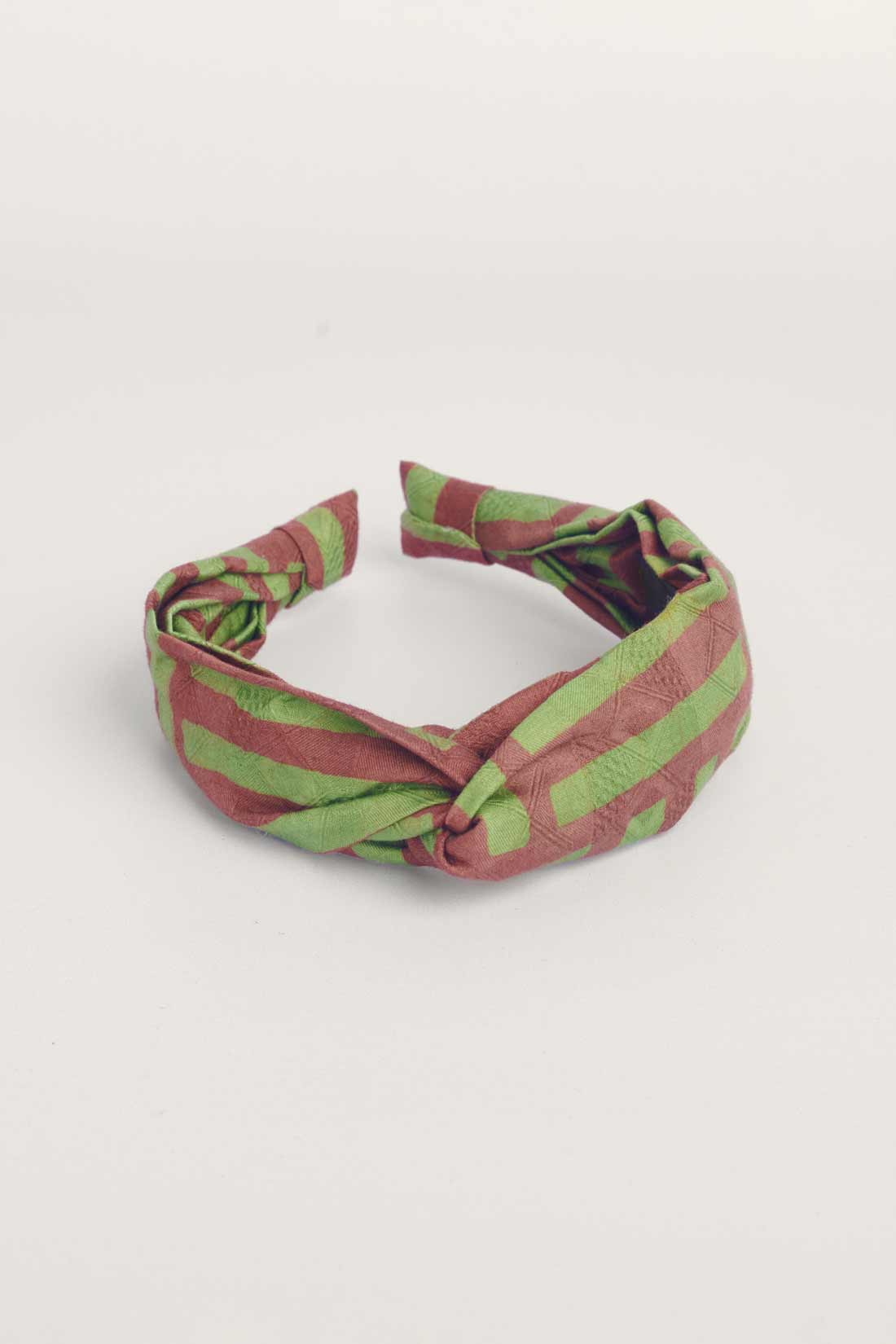 Green and brown hand-dyed batik Garden Party print headband by GEOMETRIC. 