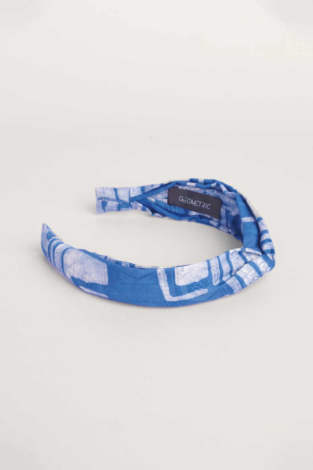 Blue hand-dyed batik Coco print headband by GEOMETRIC. 