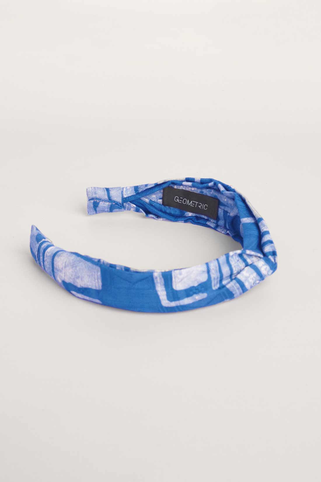 Blue hand-dyed batik Coco print headband by GEOMETRIC. 