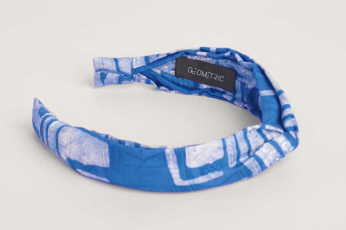 Blue hand-dyed batik Coco print headband by GEOMETRIC. 