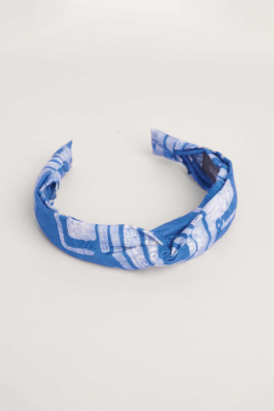 Blue hand-dyed batik Coco print headband by GEOMETRIC. 