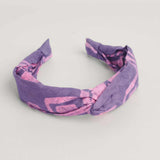 Pink and purple hand-dyed Coco batik print headband by GEOMETRIC. 