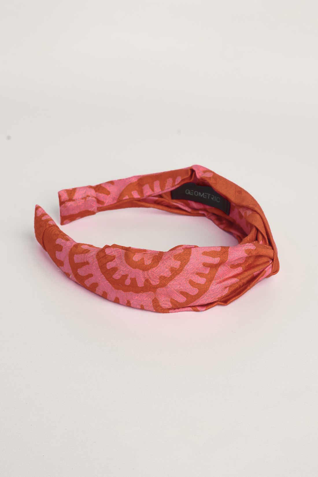 Red hand-dyed batik Shea Shell print headband by GEOMETRIC. 