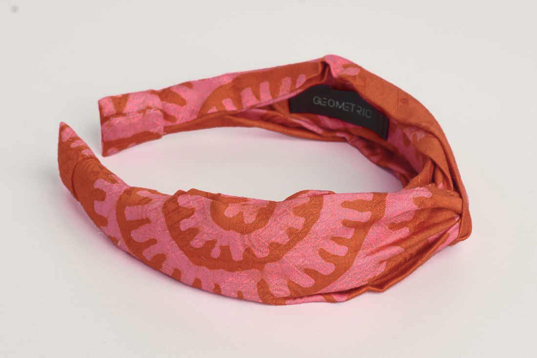 Red hand-dyed batik Shea Shell print headband by GEOMETRIC. 