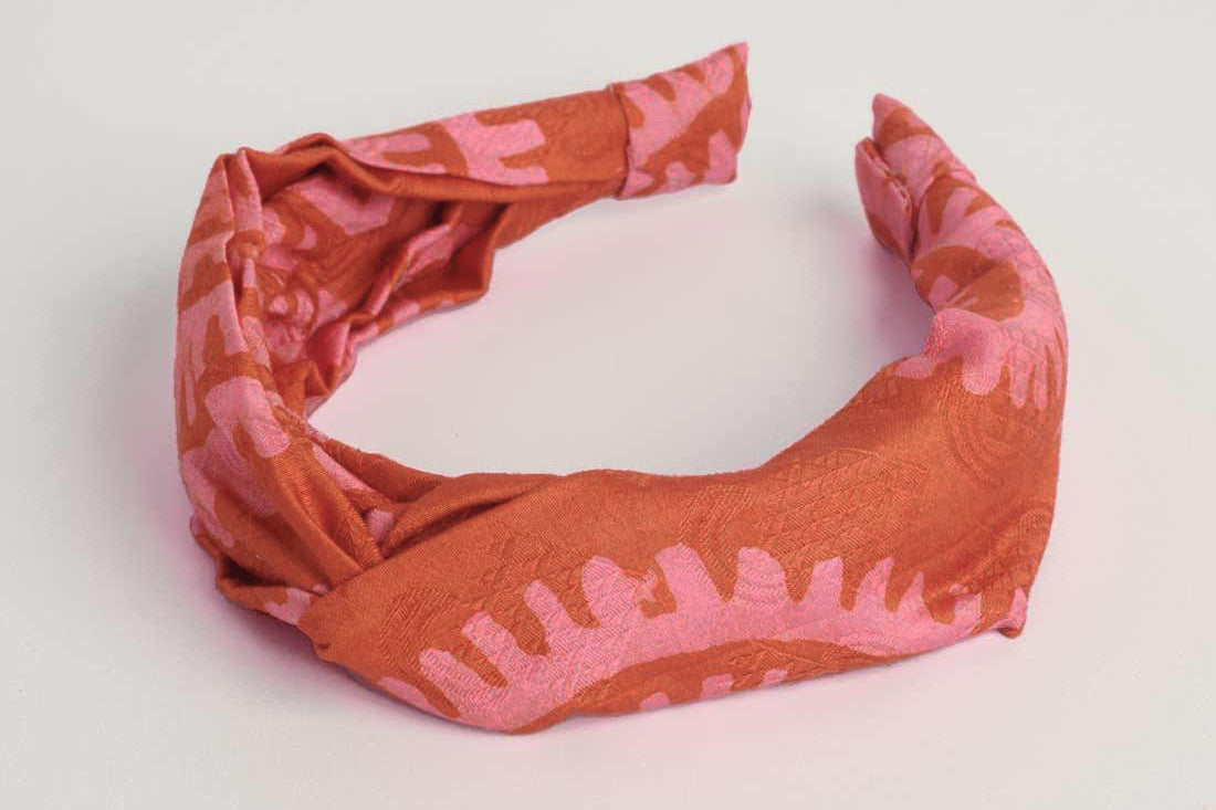 Red hand-dyed batik Shea Shell print headband by GEOMETRIC. 