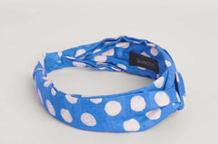 Blue hand-dyed polka dot batik print headband by GEOMETRIC. 