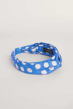 Blue hand-dyed polka dot batik print headband by GEOMETRIC. 