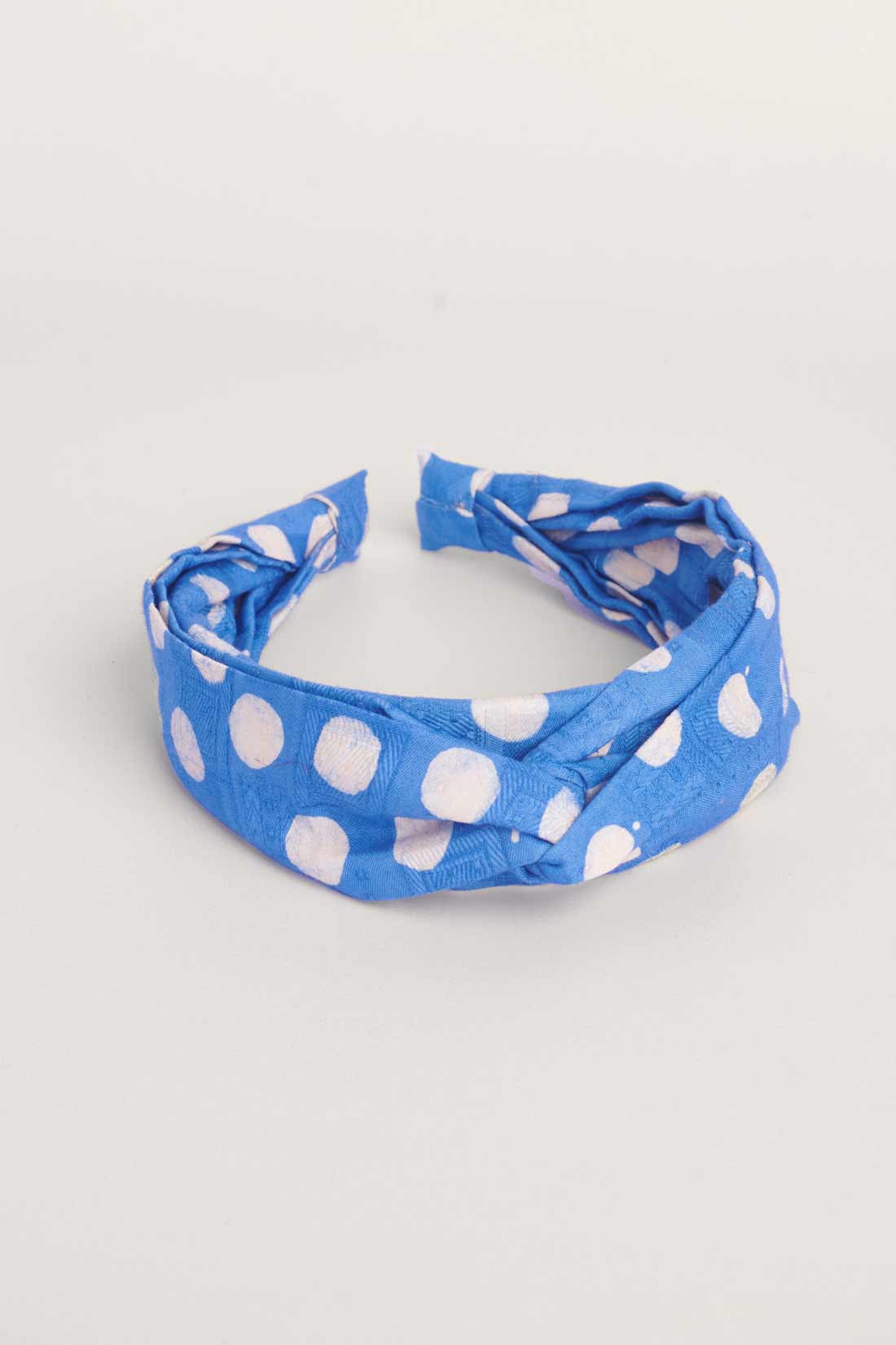 Blue hand-dyed polka dot batik print headband by GEOMETRIC. 