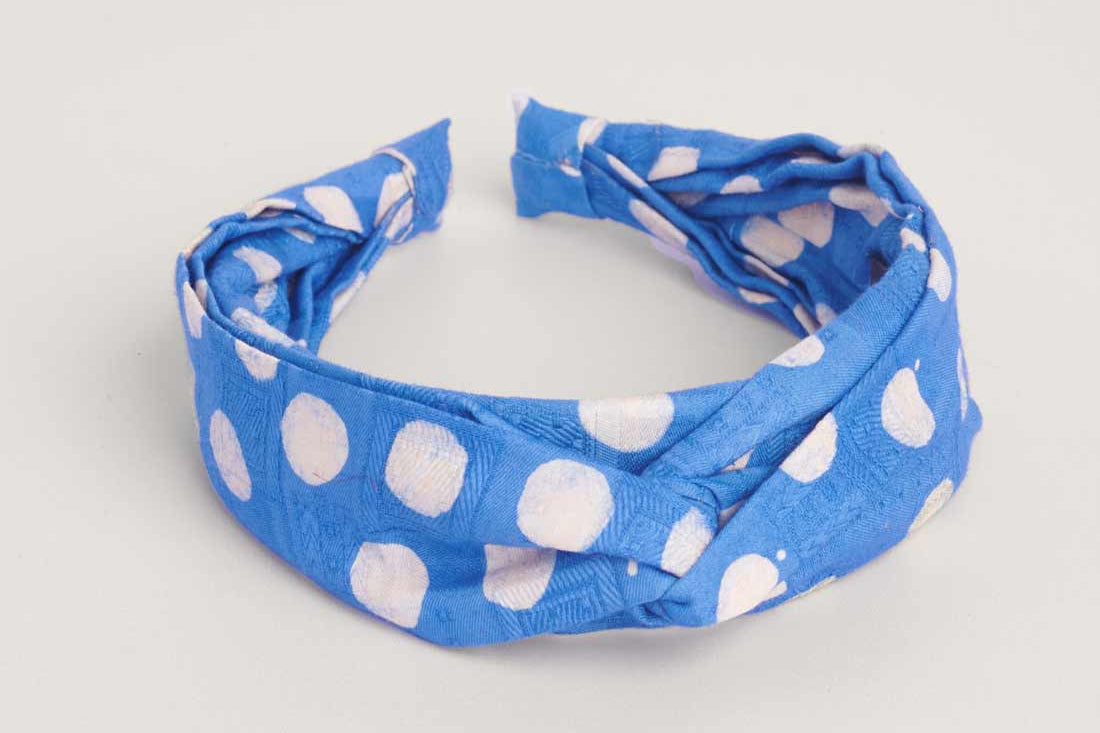 Blue hand-dyed polka dot batik print headband by GEOMETRIC. 