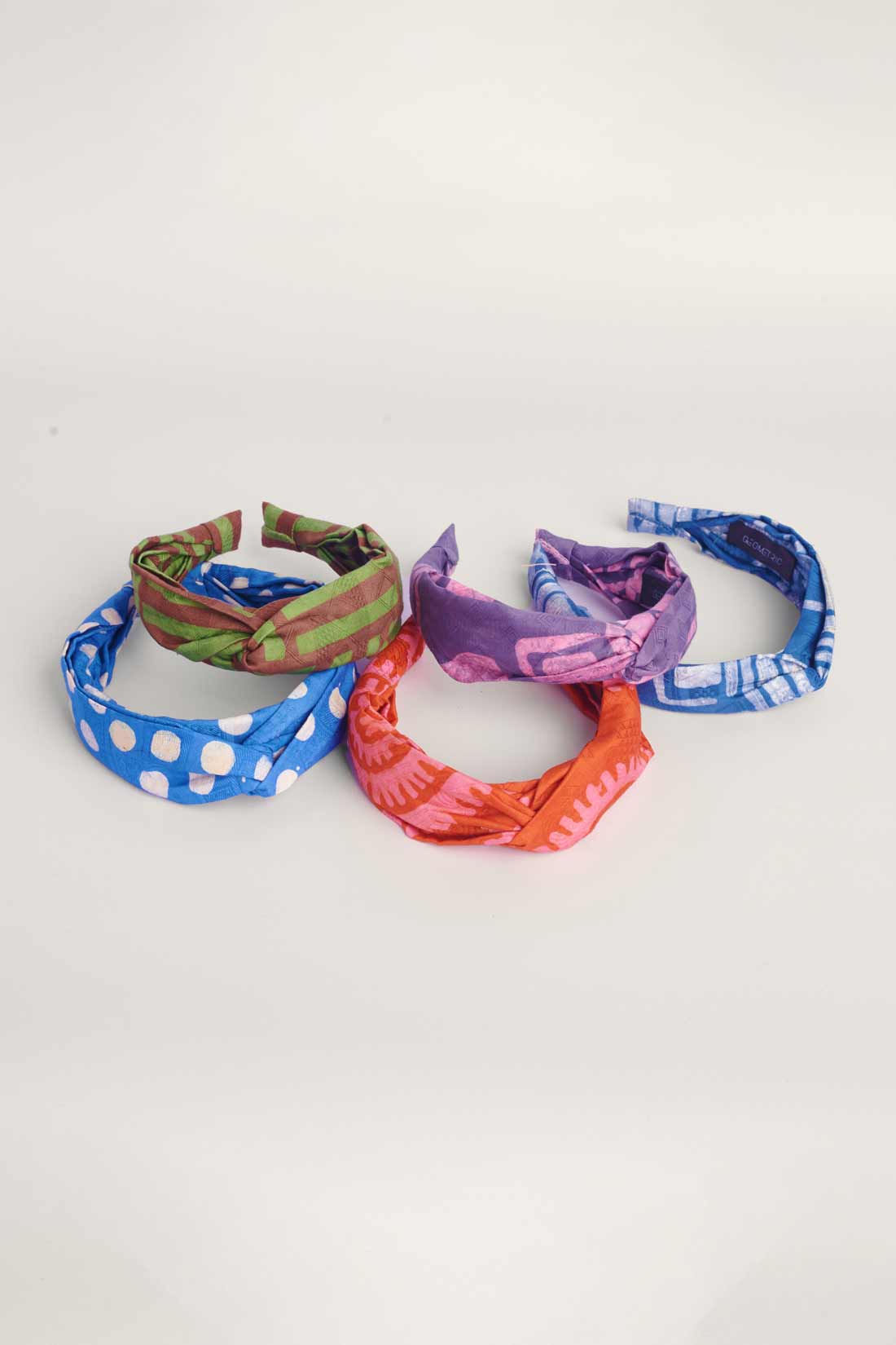 Set of 5 hand-dyed batik print headbands by GEOMETRIC. 