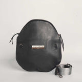 Charcoal leather Crescent cross-body bag by Geometric. 