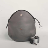 Charcoal leather Crescent cross-body bag by Geometric. 