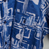 Hand-dyed blue Coco batik print short sleeve button up shirt by GEOMETRIC. 