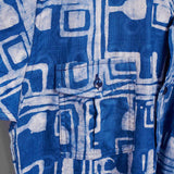 Hand-dyed blue Coco batik print short sleeve button up shirt by GEOMETRIC. 