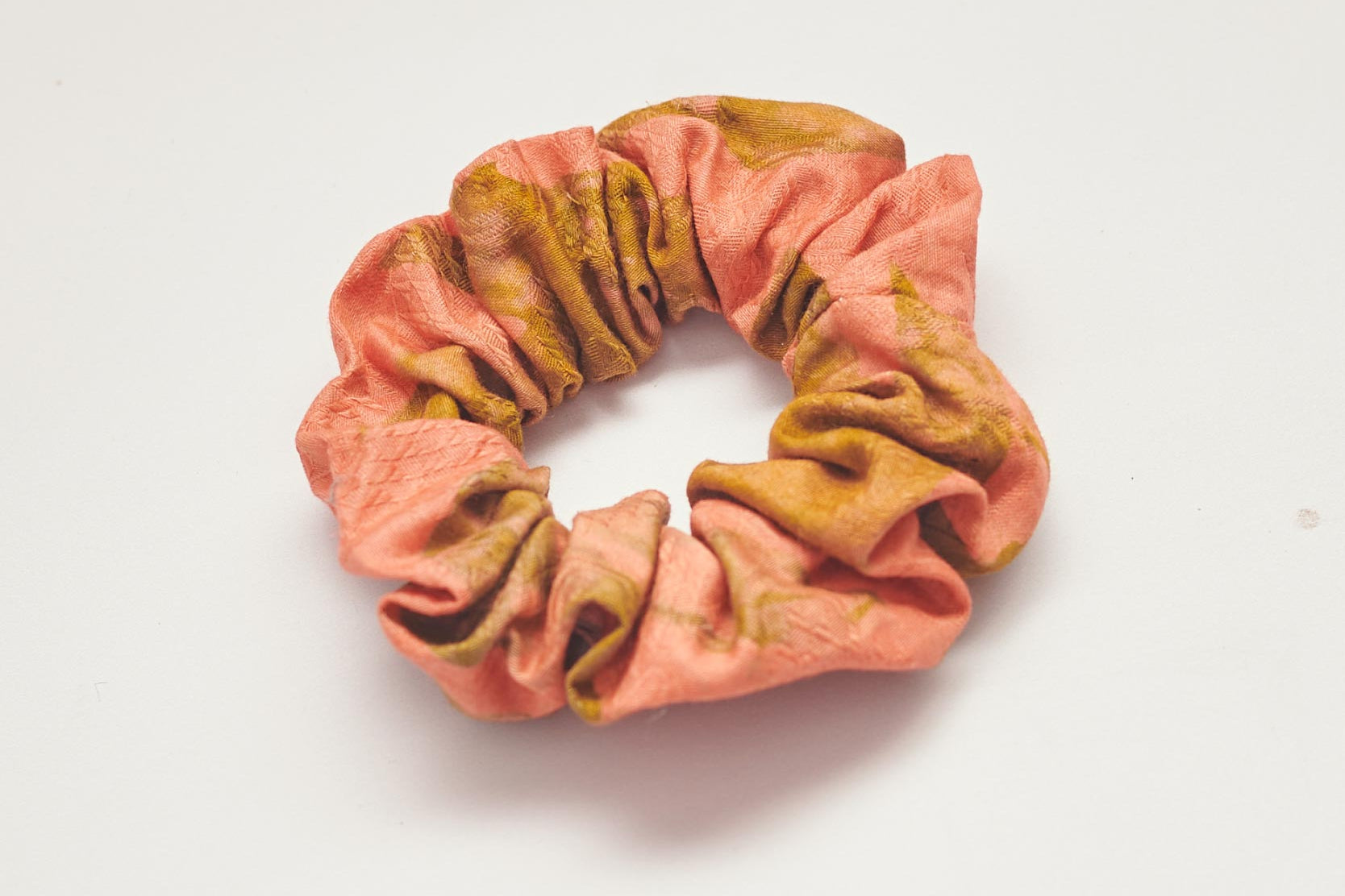 Orange hand-dyed batik print scrunchie by GEOMETRIC. 