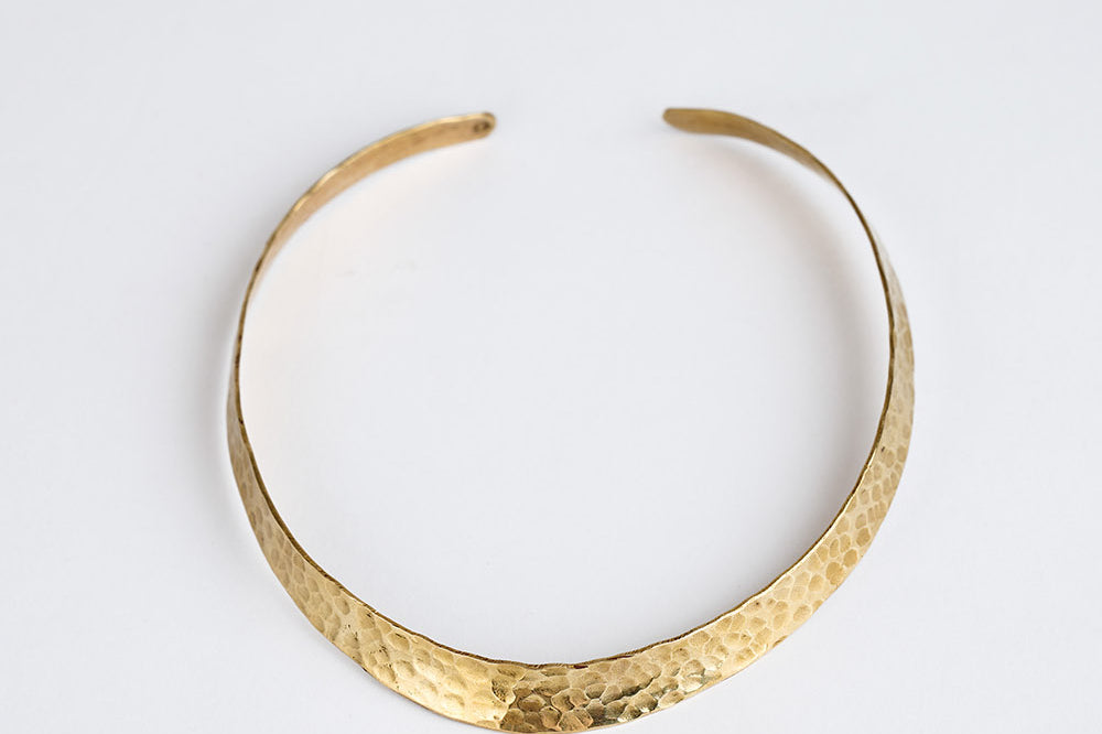 Hammered brass cuff necklace by GEOMETRIC. 