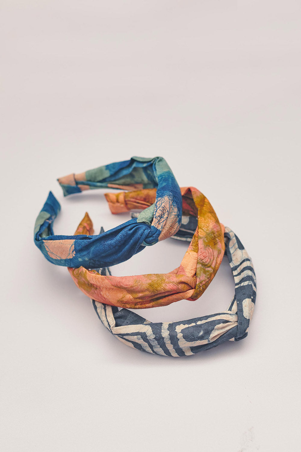 Set of three hand-dyed batik print headbands by Geometric. 