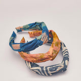Set of three hand-dyed batik print headbands by Geometric. 