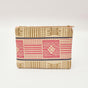 Tan and pink hand-dyed Kente print Zipper Clutch by GEOMETRIC.
