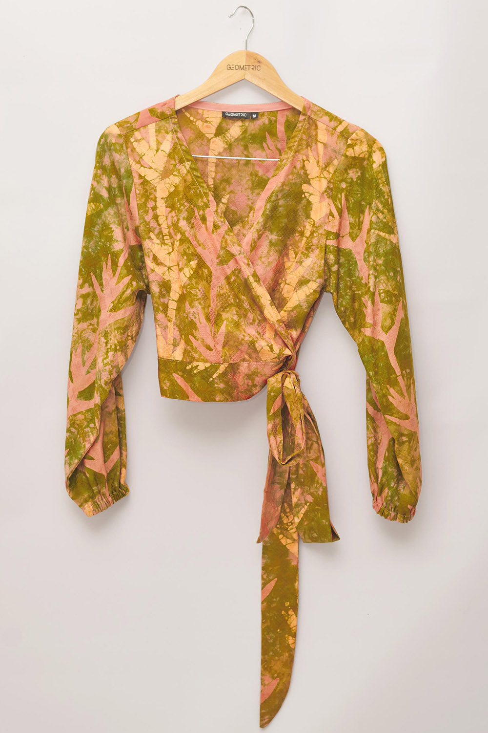Hand-dyed orange Birds of Paradise batik print long sleeve wrap top by GEOMETRIC. 