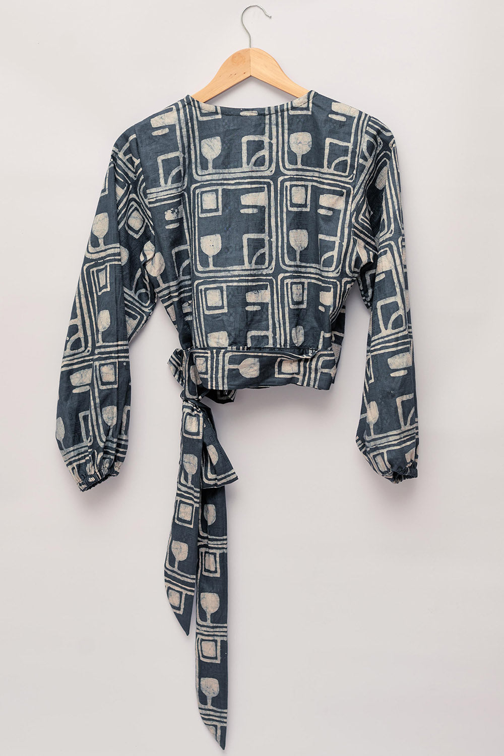 Charcoal hand-dyed batik Coco print long sleeve wrap top by GEOMETRIC. 