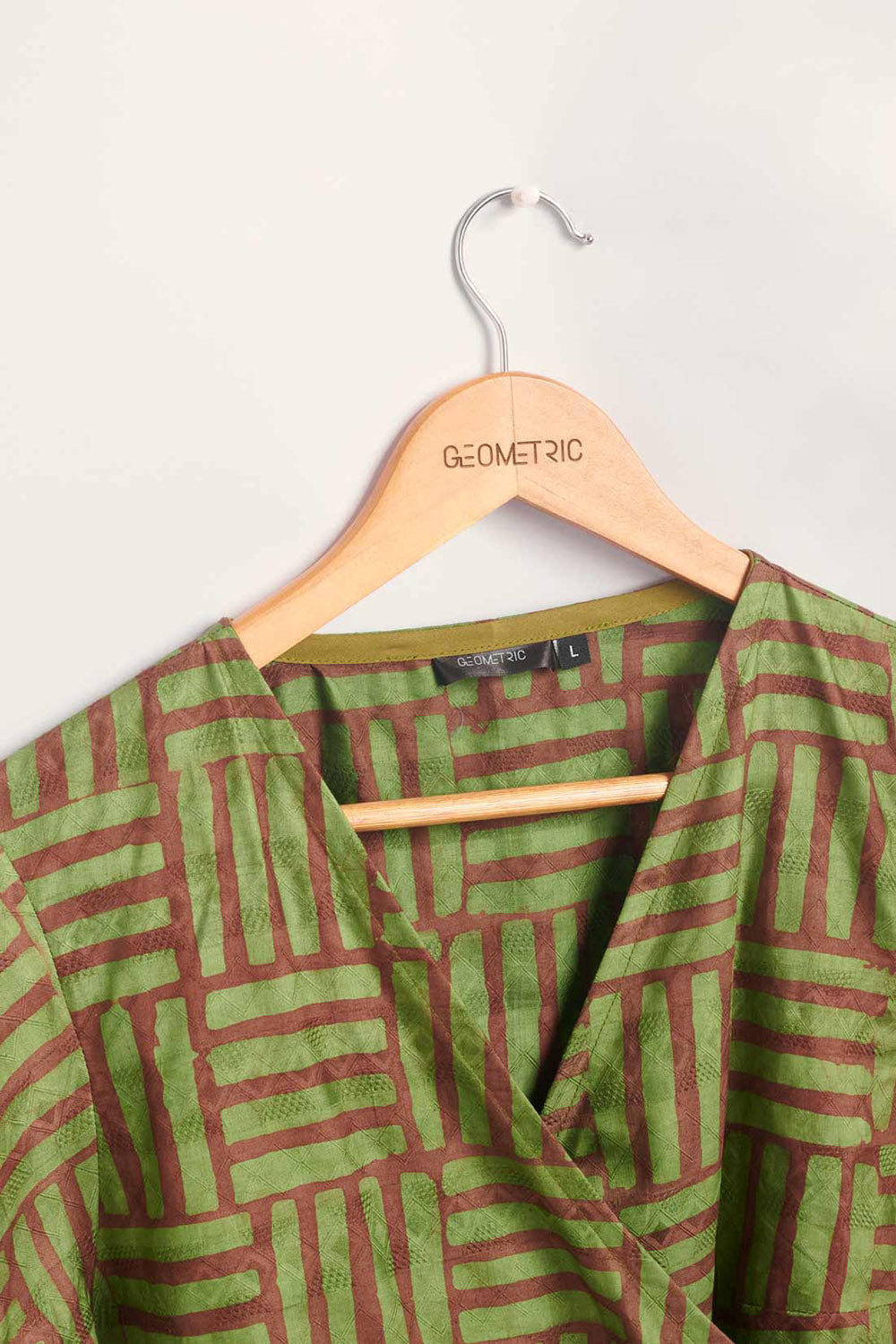 Hand-dyed green and brown Garden Party batik print Short Sleeve Wrap Top by GEOMETRIC. 