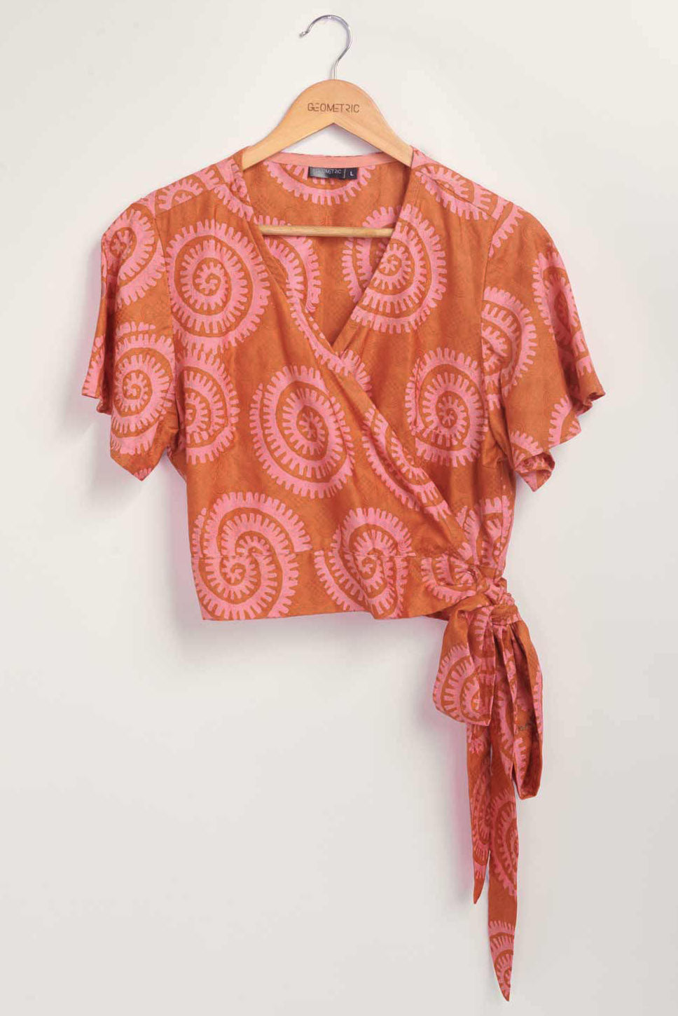 Hand-dyed pink and orange Shea Shell dot batik print Short Sleeve Wrap Top by GEOMETRIC. 