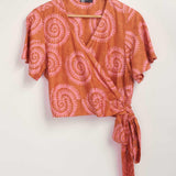 Hand-dyed pink and orange Shea Shell dot batik print Short Sleeve Wrap Top by GEOMETRIC. 
