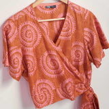 Hand-dyed pink and orange Shea Shell dot batik print Short Sleeve Wrap Top by GEOMETRIC. 