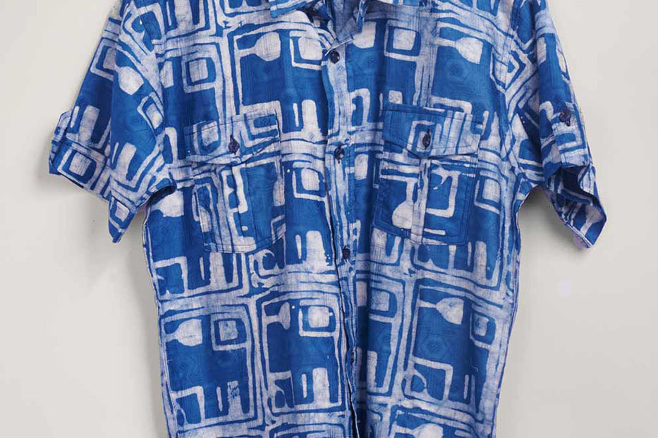 Hand-dyed blue Coco batik print short sleeve button up shirt by GEOMETRIC. 