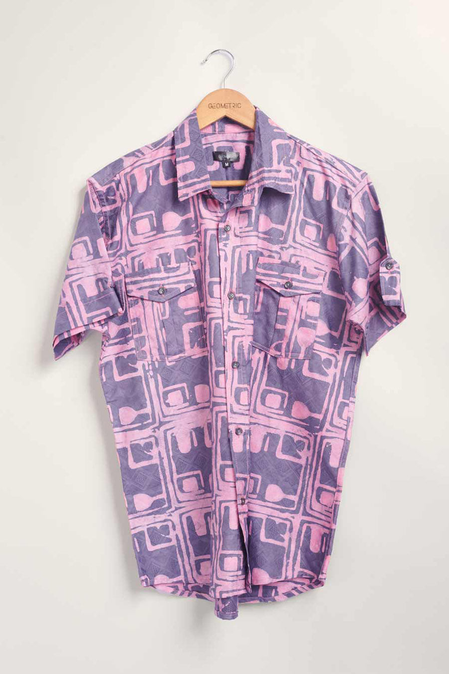 Hand-dyed blue Coco batik print short sleeve button up shirt by GEOMETRIC. 