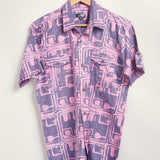Hand-dyed blue Coco batik print short sleeve button up shirt by GEOMETRIC. 