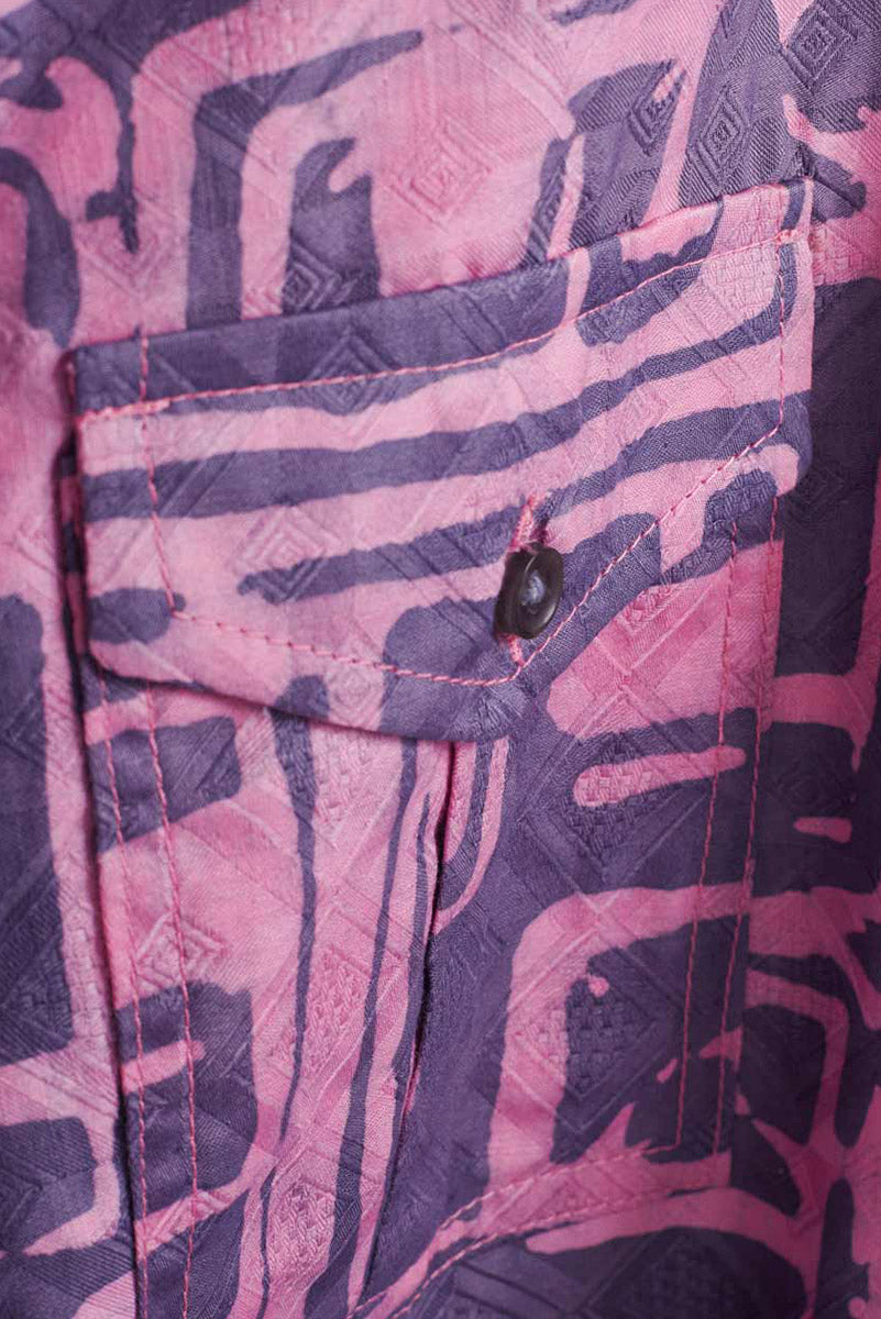 Close-up of hand-dyed blue Coco batik print short sleeve button up shirt by GEOMETRIC. 