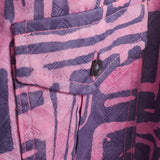 Close-up of hand-dyed blue Coco batik print short sleeve button up shirt by GEOMETRIC. 