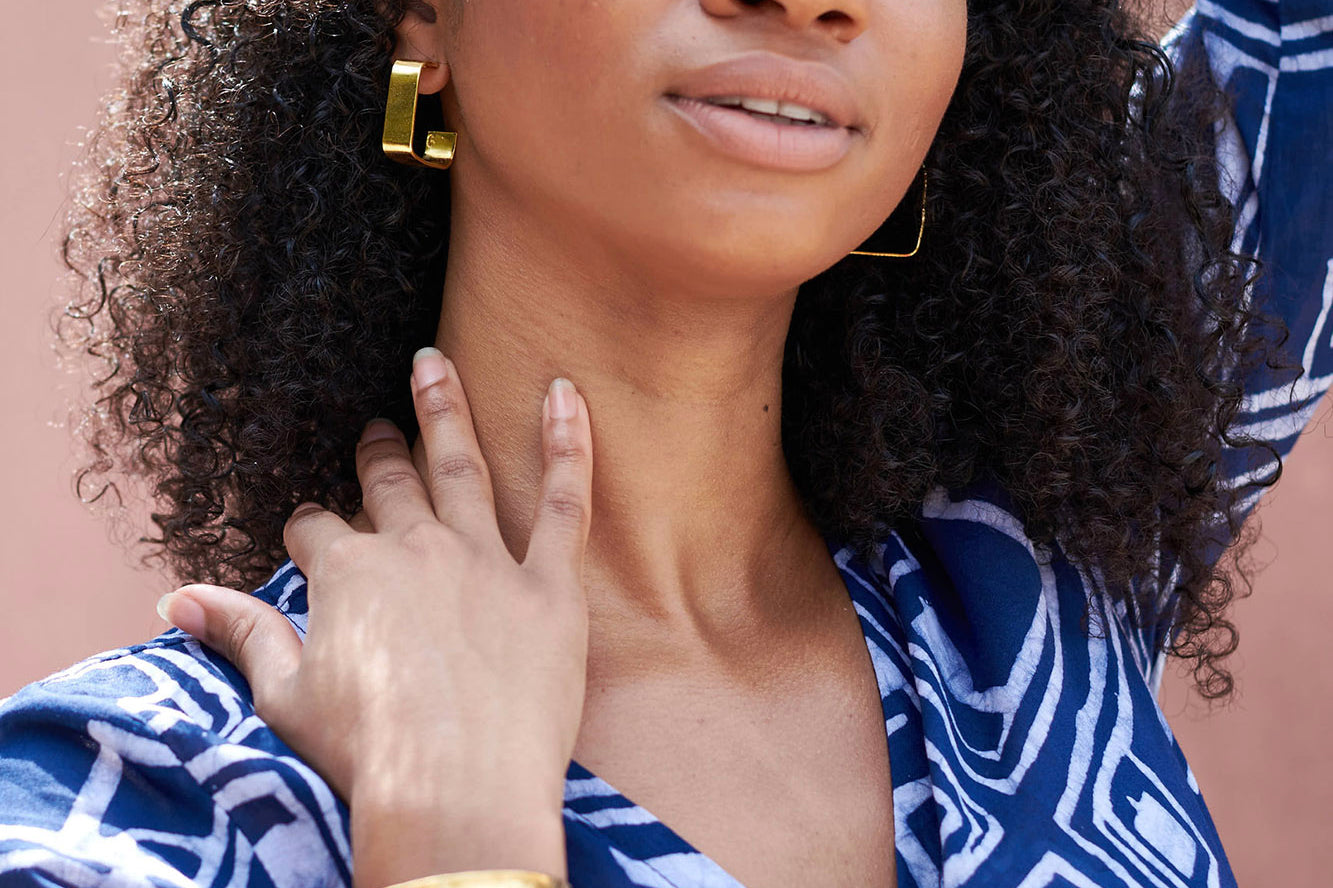 Brass square hoop earrings and brass cuff by GEOMETRIC. 