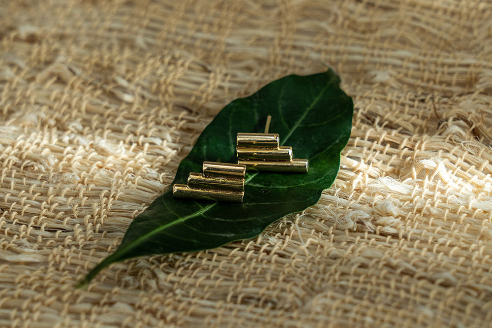 Brass Stitched studd earrings by GEOMETRIC. 