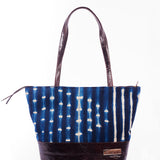 Hand-dyed indigo fabric and leather Tema tote bag by GEOMETRIC. 