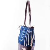 Hand-dyed indigo fabric and leather Tema tote bag by GEOMETRIC. 