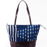 Hand-dyed indigo fabric and leather Tema tote bag by GEOMETRIC. 