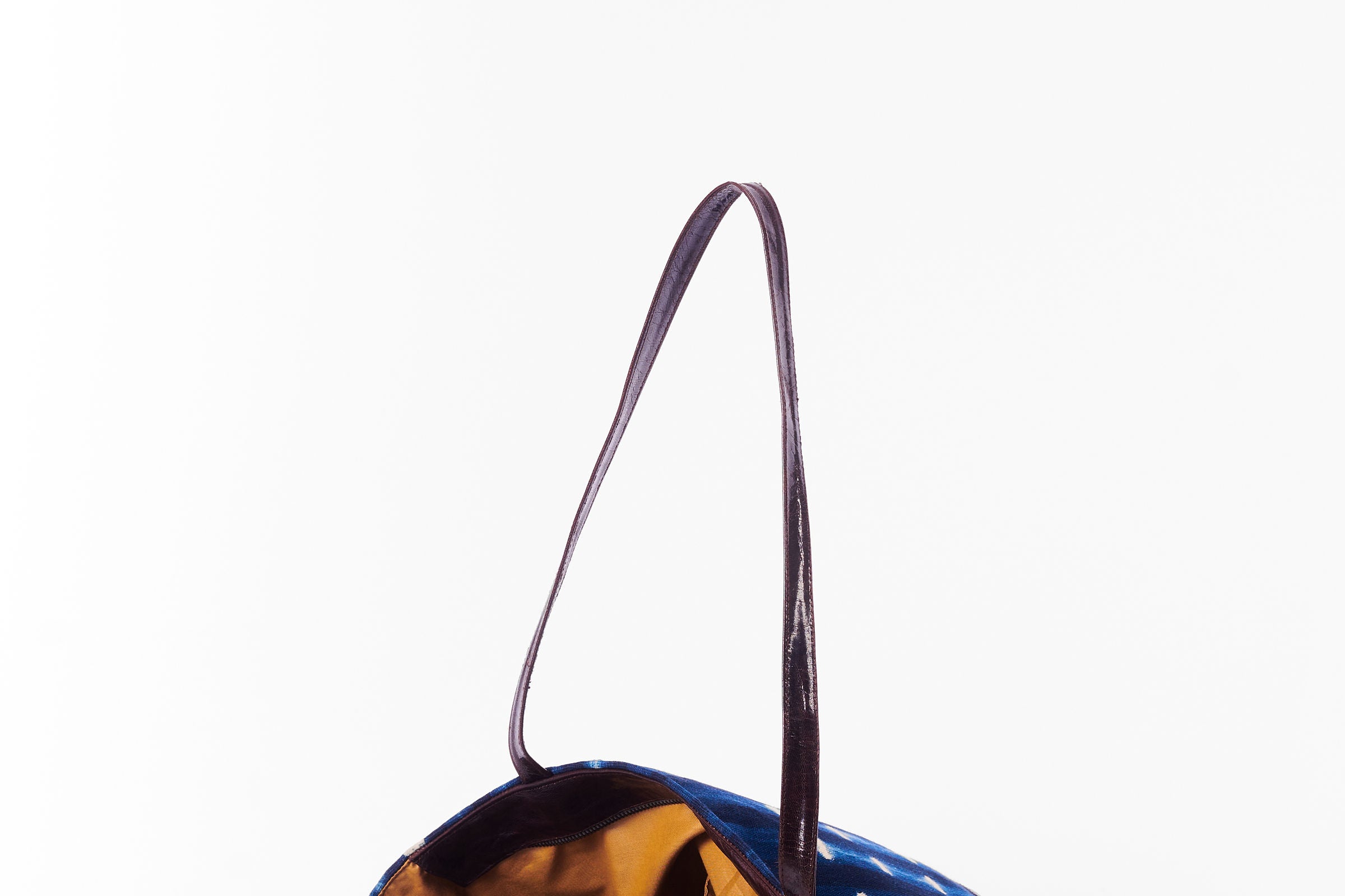 Inside view of hand-dyed indigo fabric and leather Tema tote bag by GEOMETRIC. 