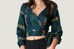 Woman wearing navy hand-dyed batik Brush Strokes print long sleeve wrap top by GEOMETRIC. 