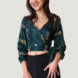 Woman wearing navy hand-dyed batik Brush Strokes print long sleeve wrap top by GEOMETRIC. 
